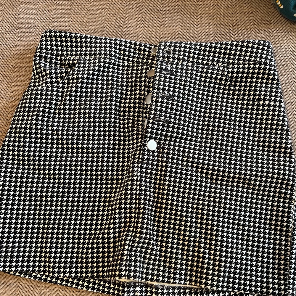 Woman black and white checkered skirt